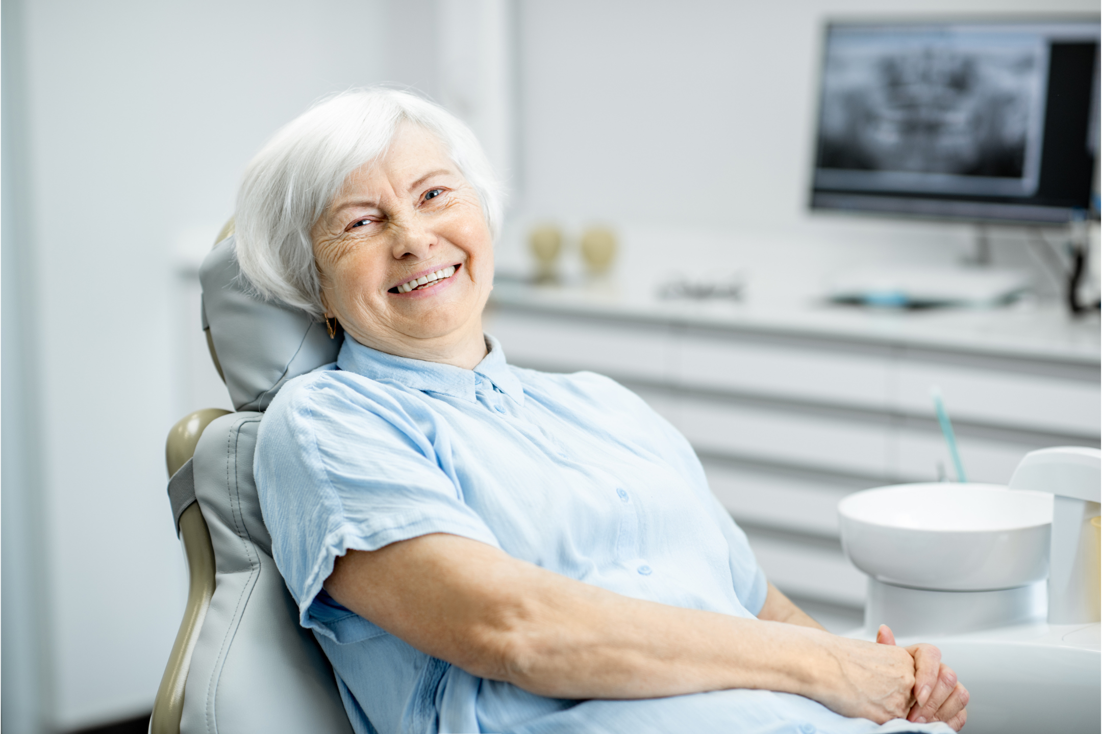 happy woman in a dental chair
